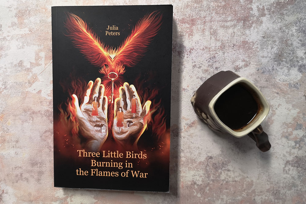 Three Little Birds Burning in the Flames of War by Julia Peters